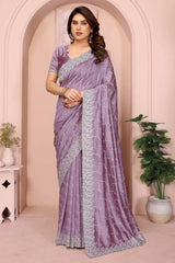 Lavender net saree with silver decorative border and lattice pattern, draped