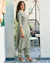 Green printed kurta and matching pants set, side view with V-neck