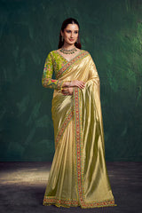 Golden tissue silk saree with lime blouse and ornate multicolor border, full drape.