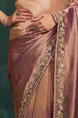 Rose metallic silk saree with gold-edged pallu and embellished border