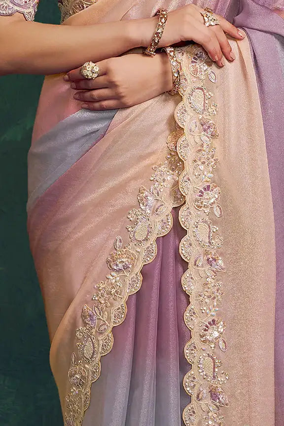 Gold embroidered saree border with bracelets and draped pallu in ombre silk