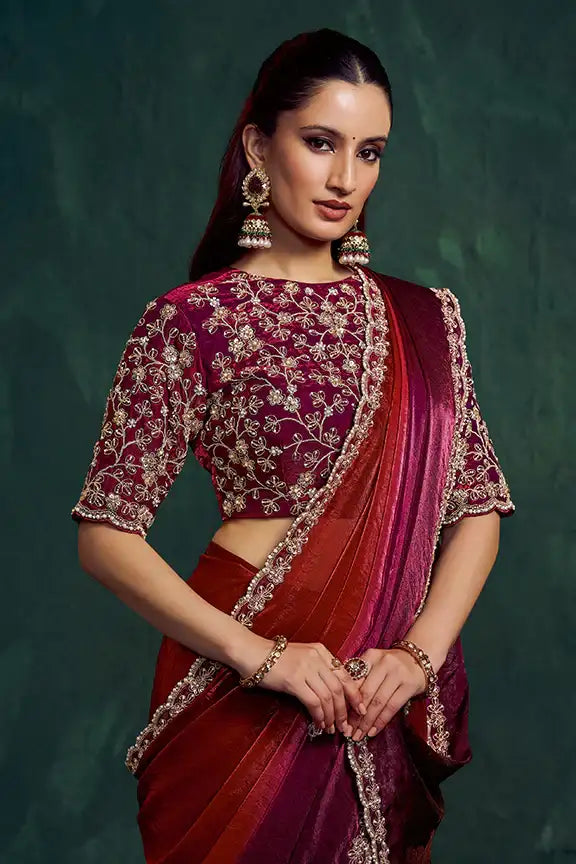 Artisanal silk saree with maroon blouse, gold embroidery, and wine ombre pallu