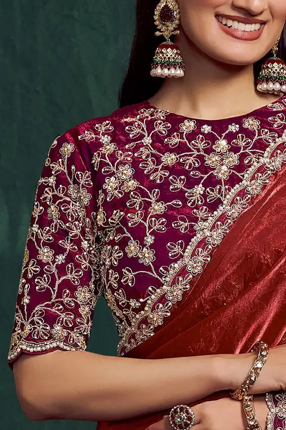 Maroon silk saree with ornate gold floral neckline embroidery on the pallu