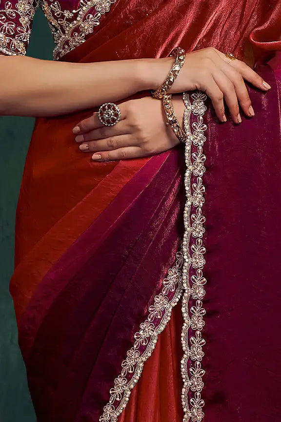 Maroon silk saree pallu with metallic gold chain border and draped pleats