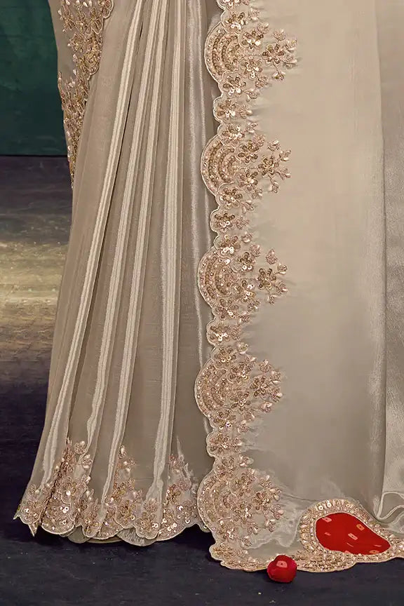 Off-white saree border with gold floral embroidery and red embellishments