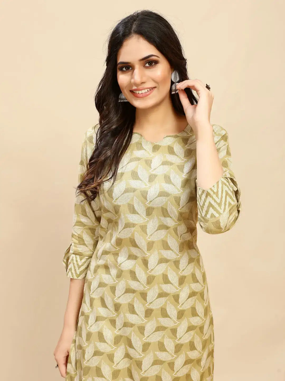 Printed cotton kurta with leaf pattern in light green and cream, close-up