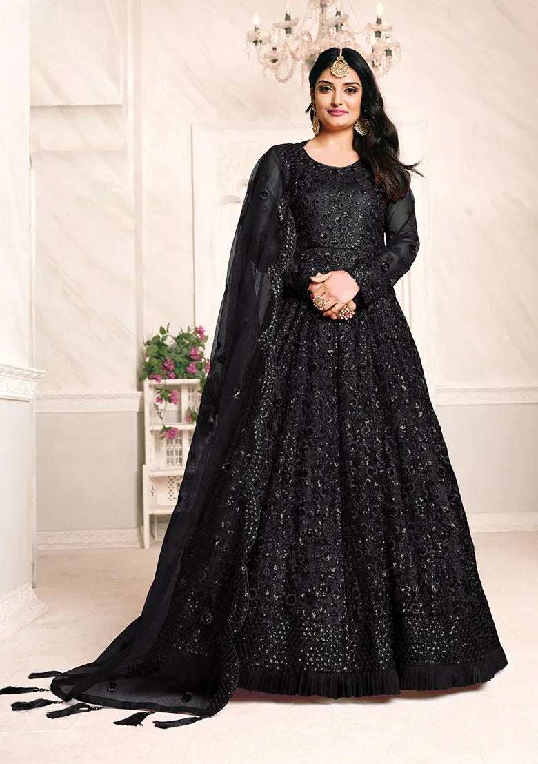 Black printed salwar suit with mirror embellishments, long kurta and dupatta.