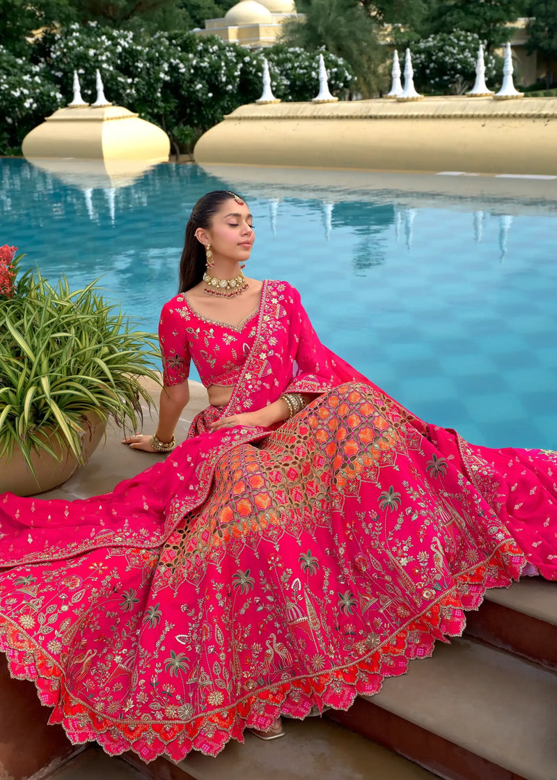Embroidered pink lehenga skirt with ornate gold pattern and matching long dupatta
