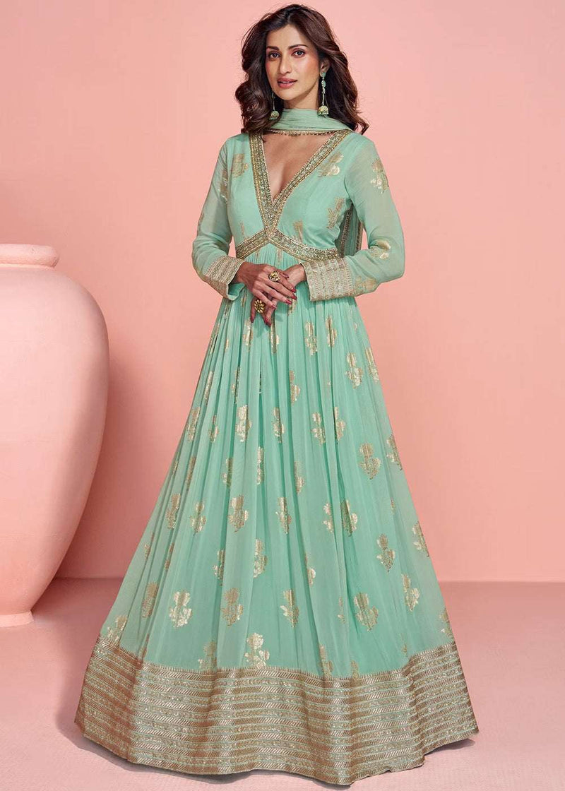 Mint green jacquard viscose-silk gown with gold trim, V-neck, long sleeves, full skirt.
