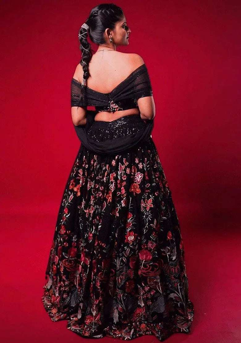 Black floral embroidered lehenga skirt with off-shoulder sequin blouse set (back)