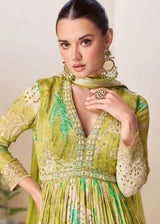 Green floral V-neck anarkali dress with pleated bodice, gold edging at neckline and cuffs
