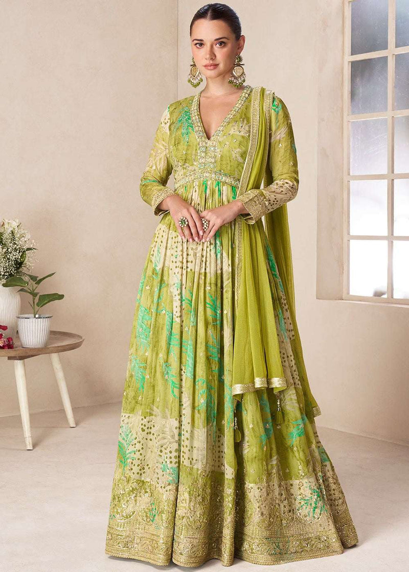 Green floral Anarkali gown with V-neck, long sleeves, and gold trim, full-length flare