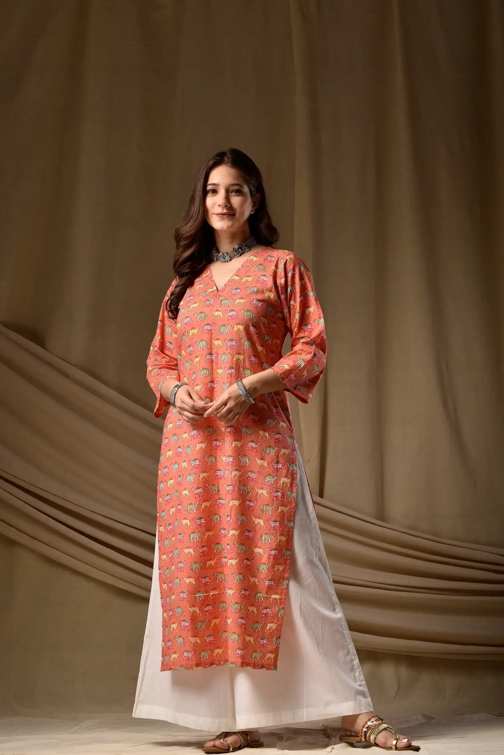 Coral printed rayon kurti, three-quarter sleeves, white hem trim