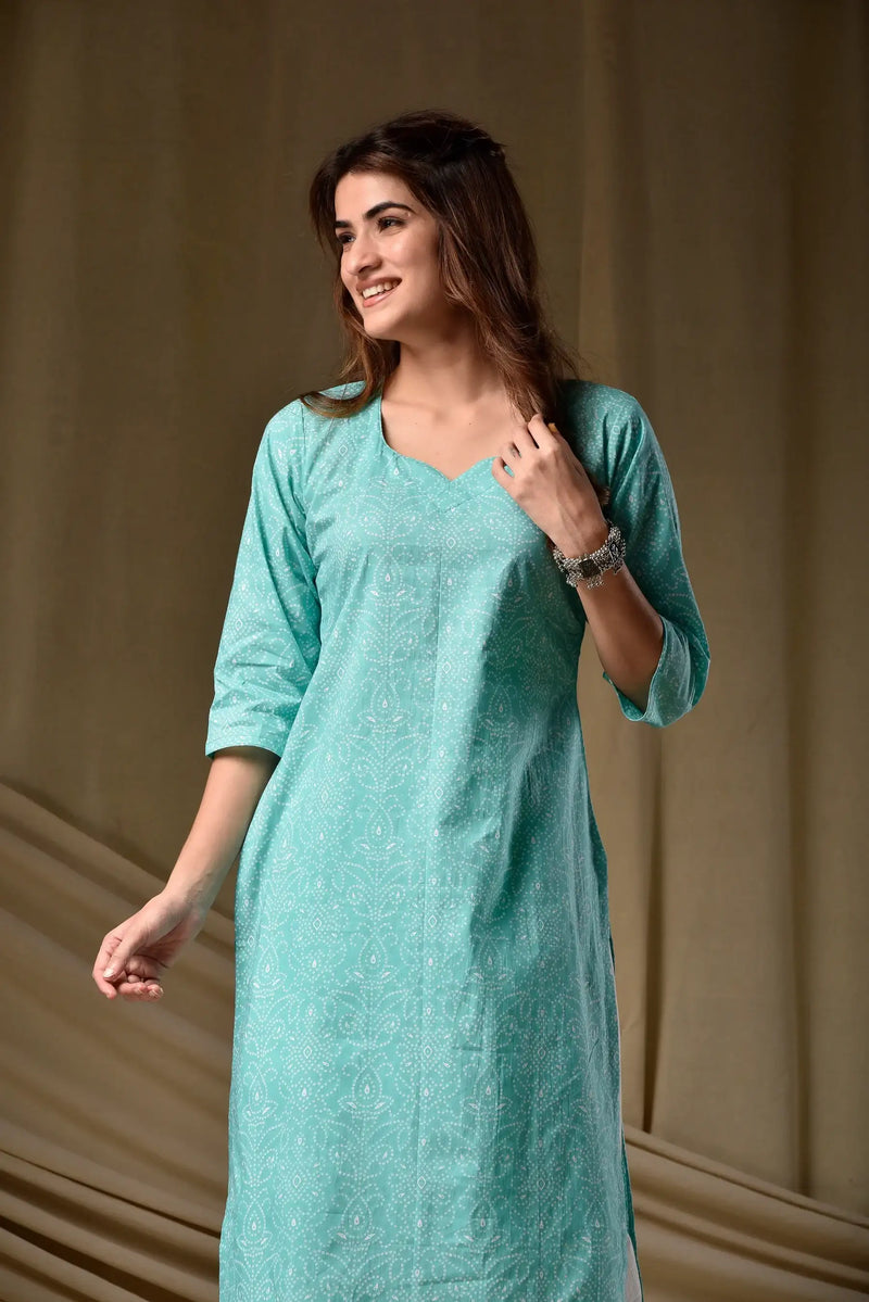 Mint green rayon kurti with V-neck and three-quarter sleeves, allover printed detail