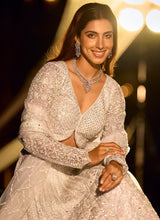 Silver Swarovski net lehenga with long-sleeve V-neck blouse and full embellished skirt