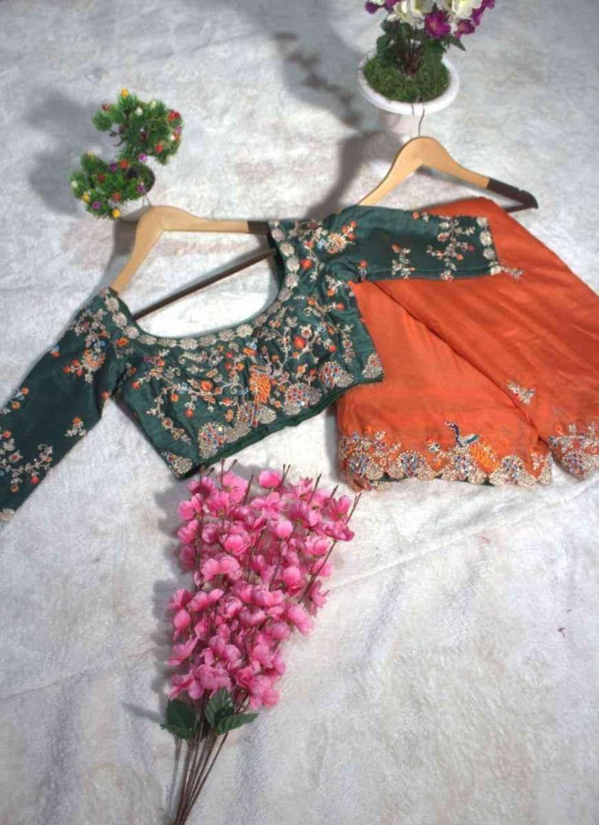 Organza mirror saree set on hangers, orange drape with dark green floral blouse