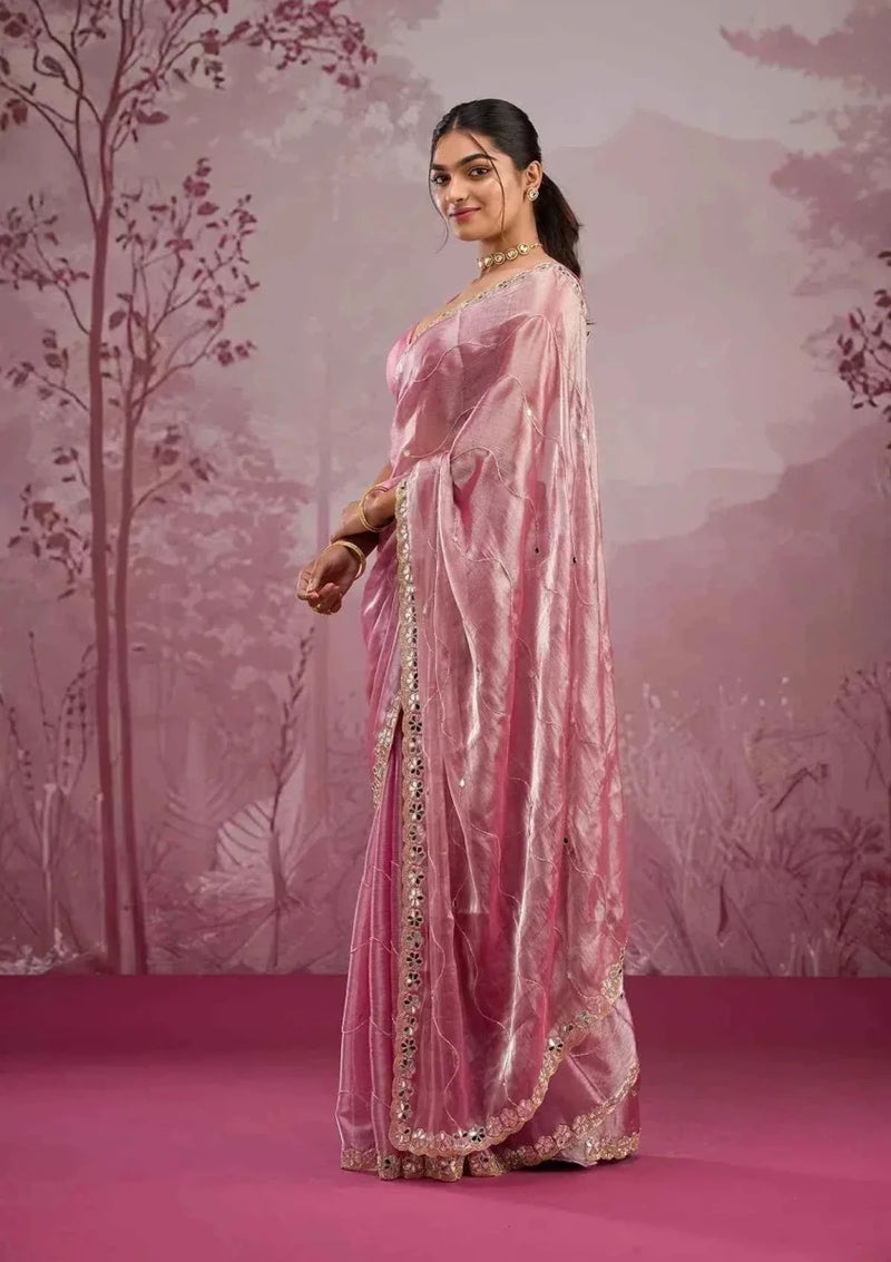 Baby pink silk saree with mirror-work border and shimmering sequin detailing