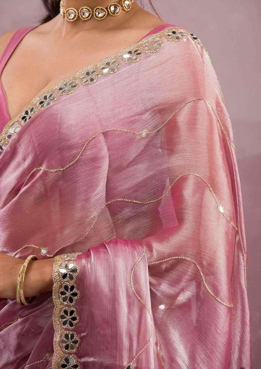 Baby pink silk saree shoulder detail with mirror-work and cutwork trim