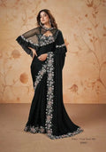Black crepe satin saree with floral embellished border and sequined sleeves