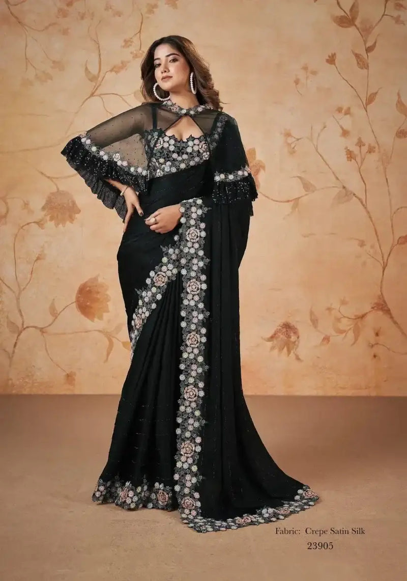 Black crepe satin saree with floral embellished border and drape, sleeveless blouse style