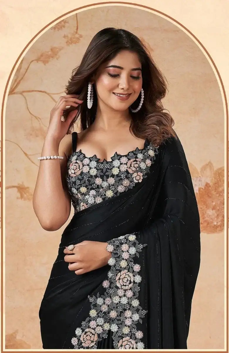 Black floral embellished saree with embroidered bodice and matching sleeve trim