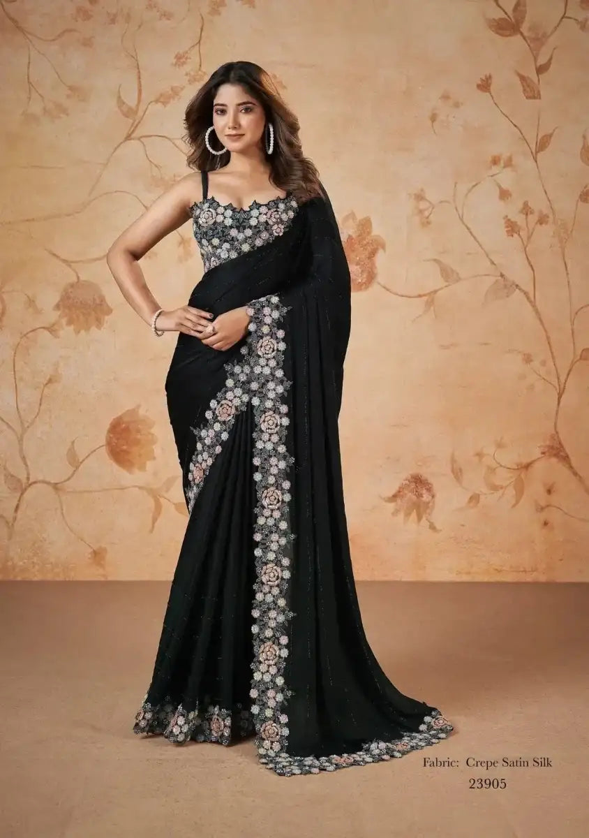 Black crepe satin saree with floral embroidered border and embellished pallu