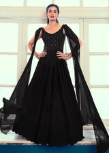 Black embroidered long gown with square neckline, flared skirt and sheer cape sleeves
