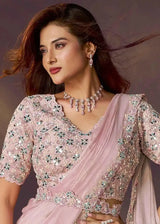 Blush pink ready-to-wear saree with floral lace border and draped pallu
