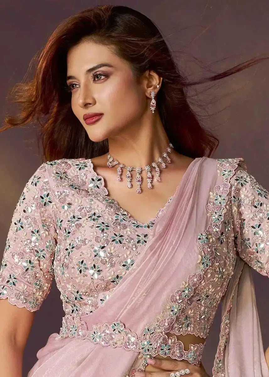 Blush pink saree with embroidered floral blouse, jeweled neckline and drape