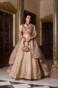 Embroidered beige-gold lehenga with matching blouse and draped dupatta