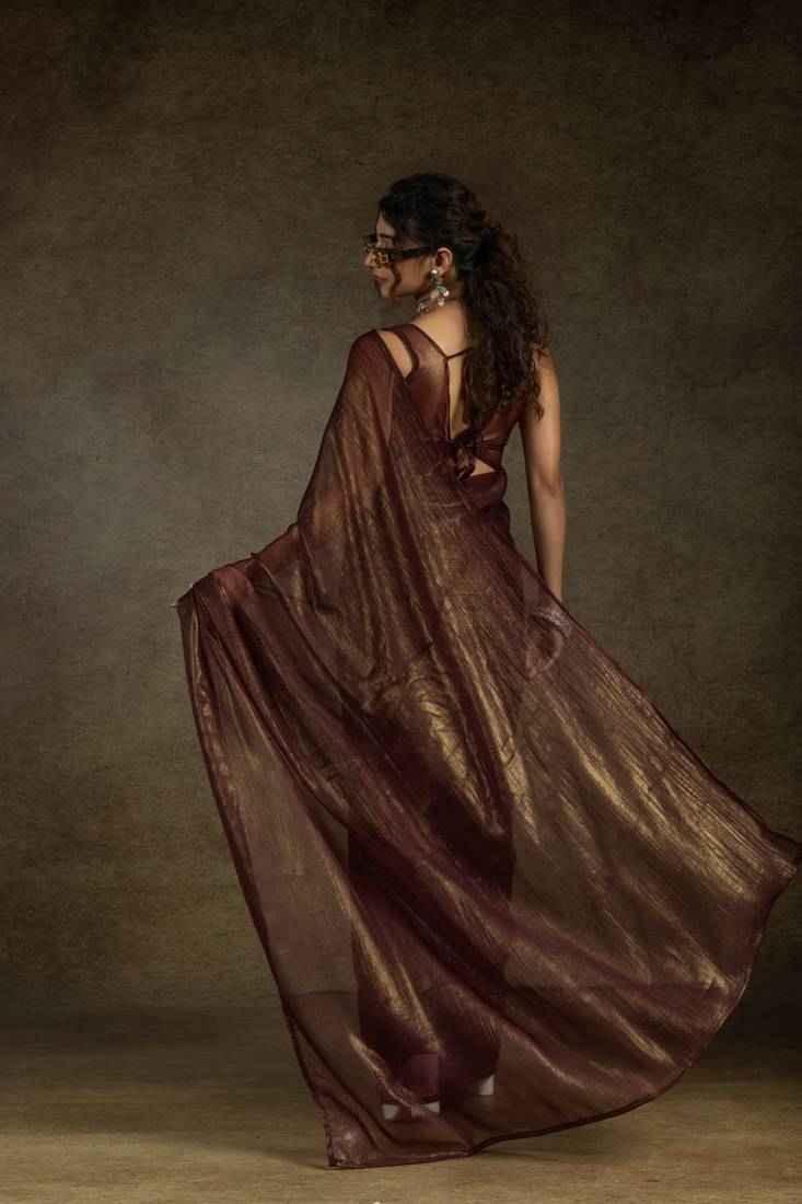 Dark brown satin chiffon saree with gold shimmer, side drape and long pallu