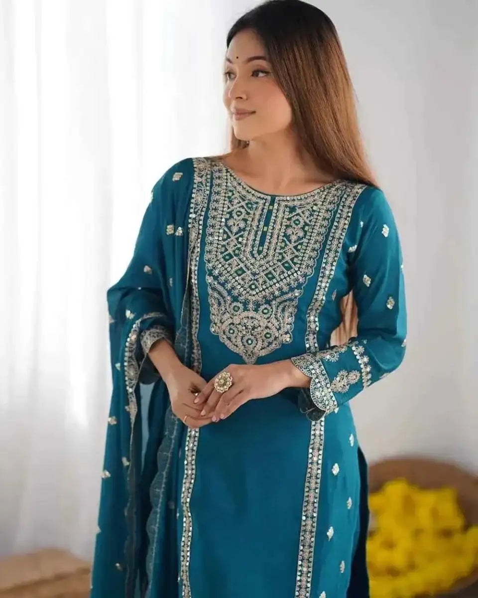 Teal embroidered kurta with vertical border detail and patterned sleeves, side view