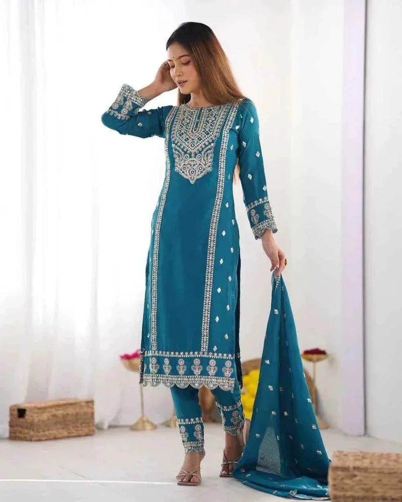 Embroidered teal kurta and palazzo set with patterned yoke, dupatta trailing