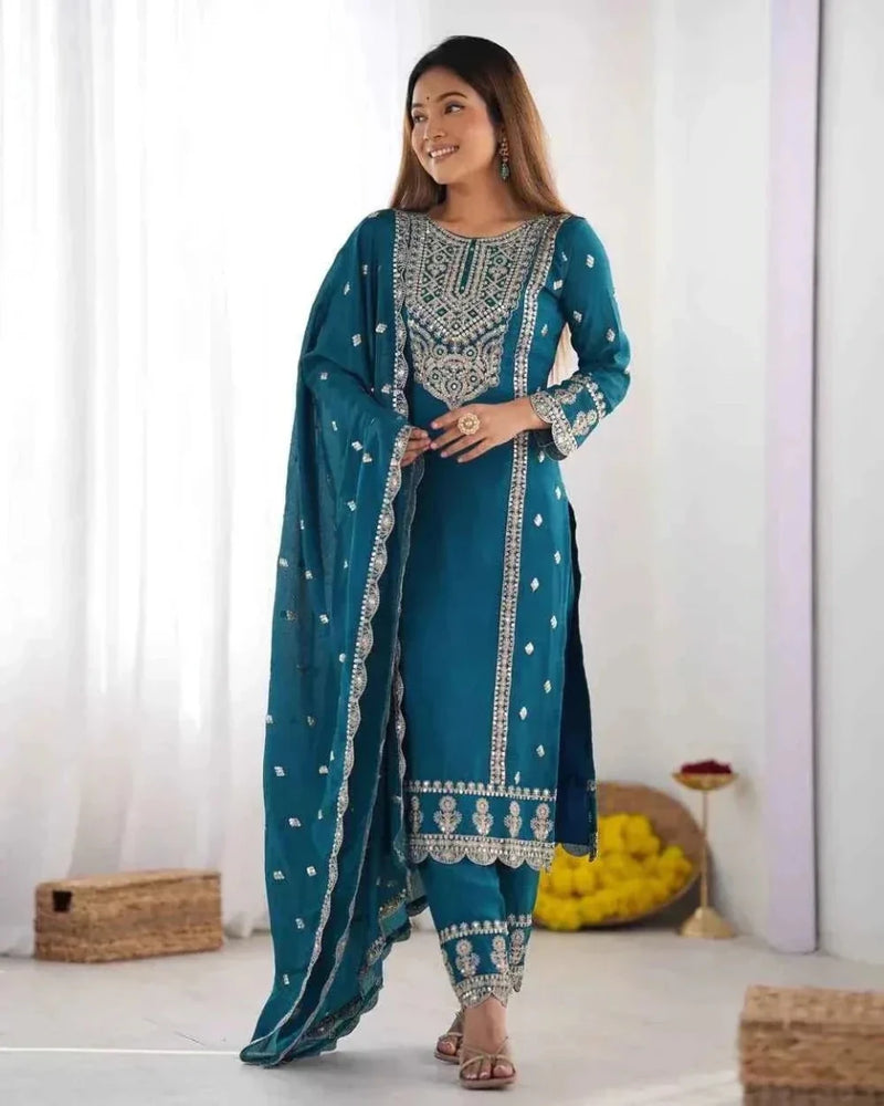 Embroidered teal kurta and palazzo set with draped dupatta, side view