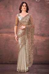 Champagne gold foil satin saree with floral net sleeves and draped pleats