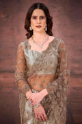 Champagne gold foil satin net saree with sheer embroidered sleeves and necklace set