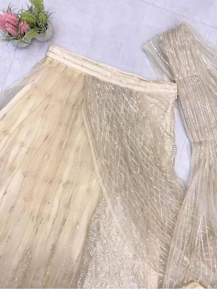 Champagne sequin net saree fabric with border trim and pleated drape panel