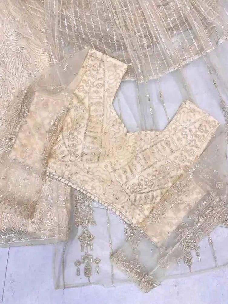 Champagne net saree blouse and dupatta pieces with all-over sequin and bead-like work