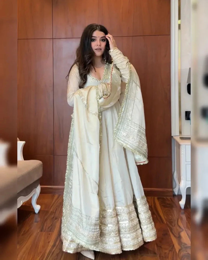 Ivory anarkali suit set with gold sequin details and matching dupatta, front view