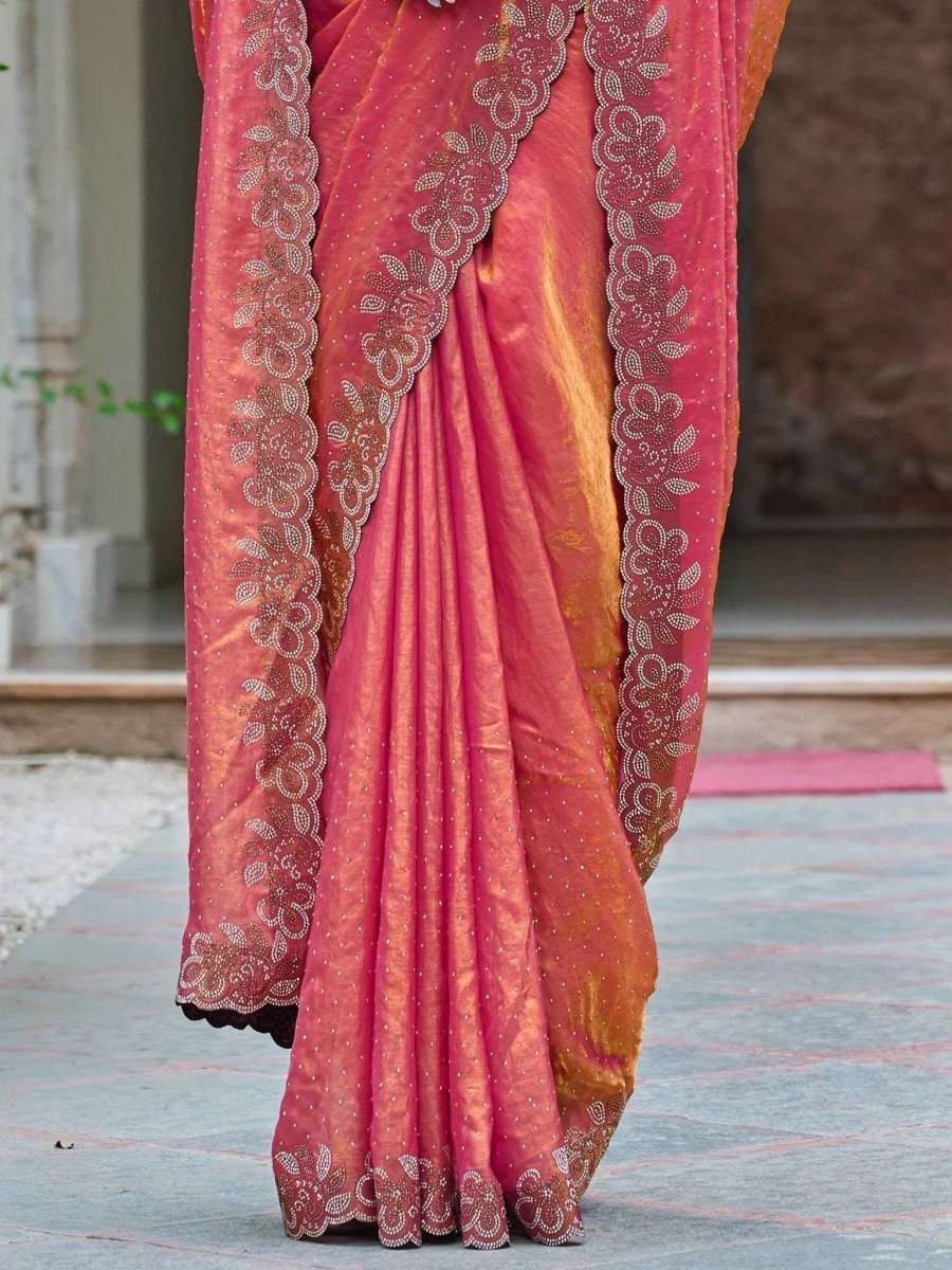 Coral rose silk saree with patterned border and diamond work detailing on the hem