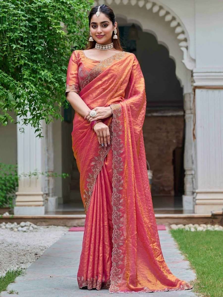 Coral rose silk saree with diamond work and ornate border, draped with matching blouse