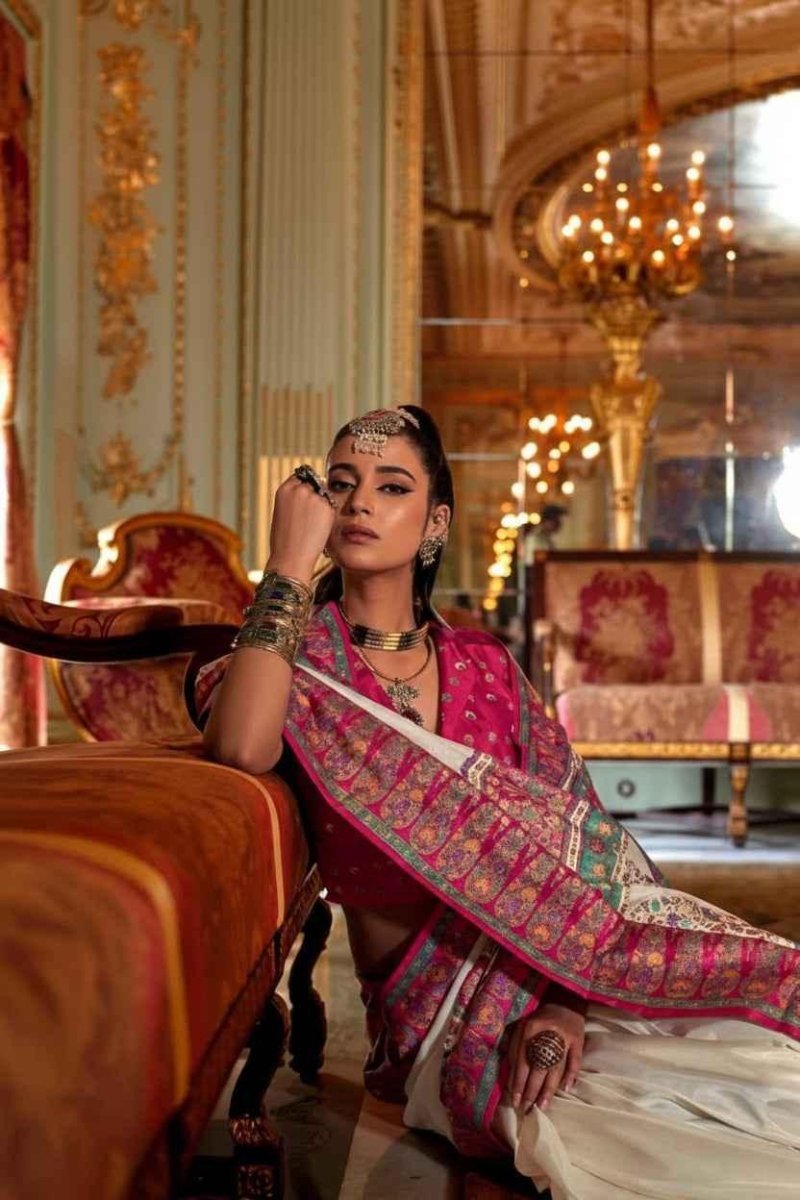 Cream silk saree with royal pink patterned border and pallu, side drape