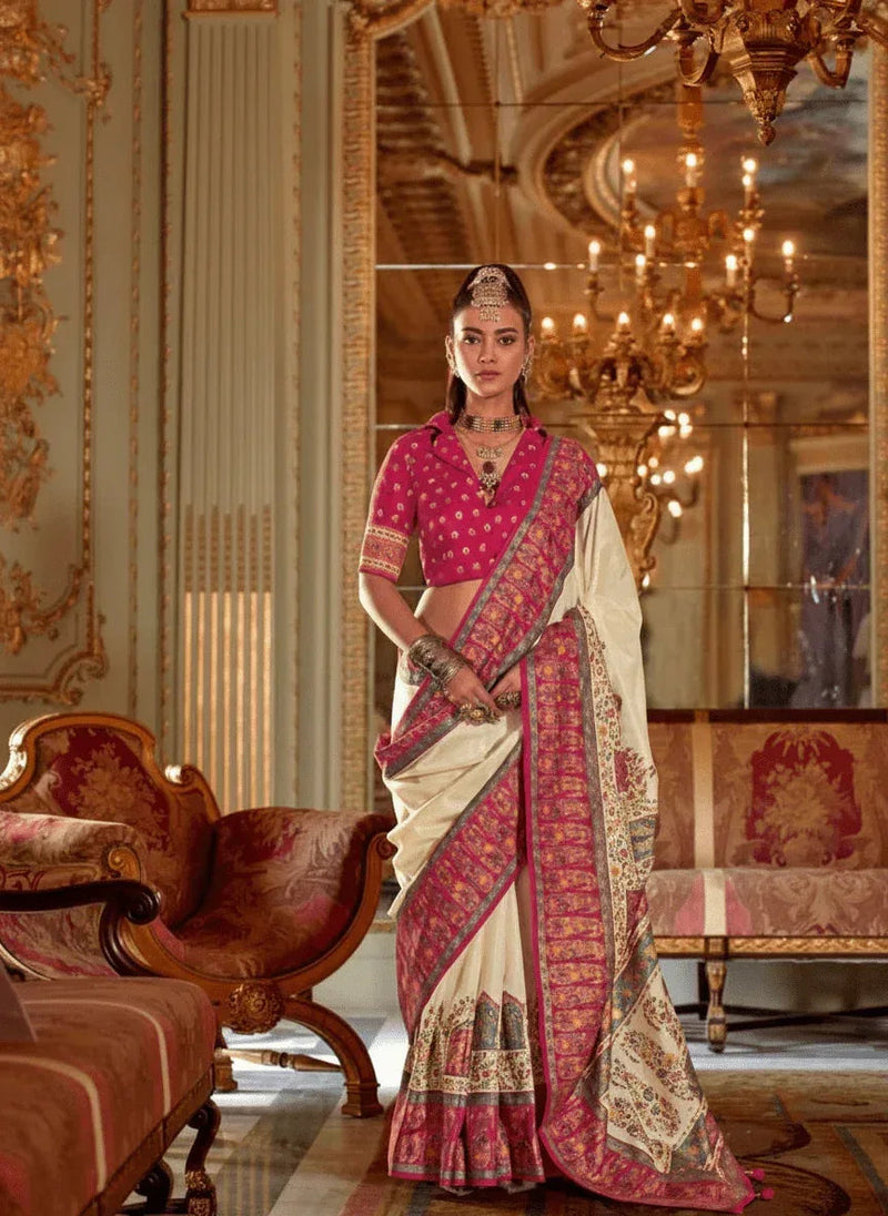 Cream silk saree with royal pink printed border and pallu, draped full length