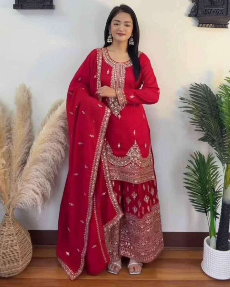 Embroidered crimson palazzo suit with long kurta, matching patterned pants, and dupatta