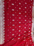 Embroidered festive saree in crimson red with silver dot motifs and decorative border