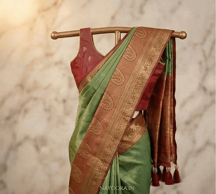Dual tone silk saree, green body with rust-gold zari border and paisley pallu