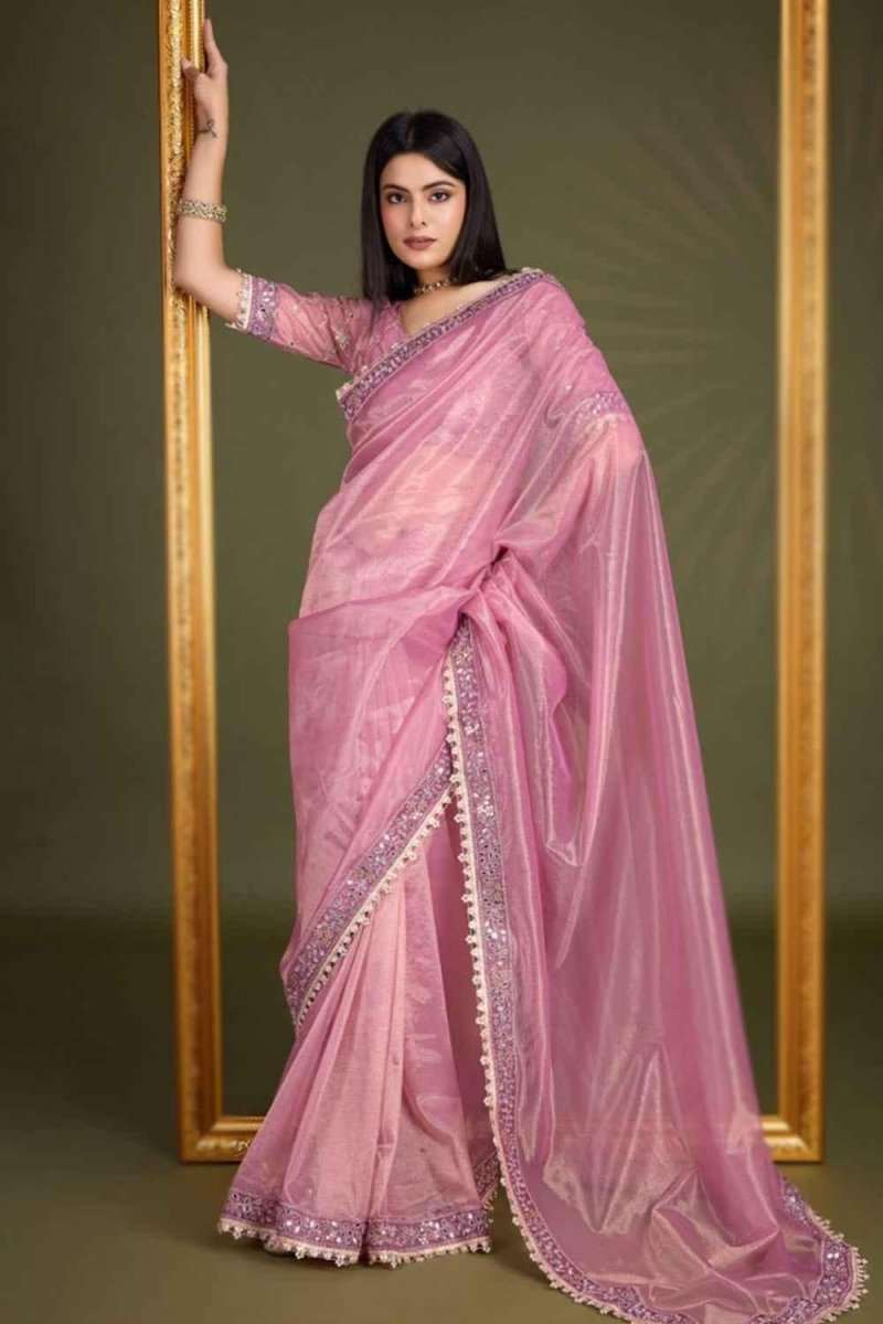 Dusty pink saree with ornate gold-toned border and full-length drape