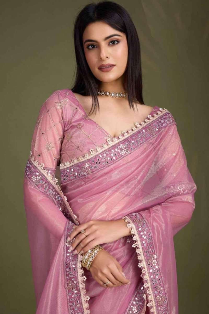 Dusty pink saree with gold-toned sequin trim, embellished neckline, and drape