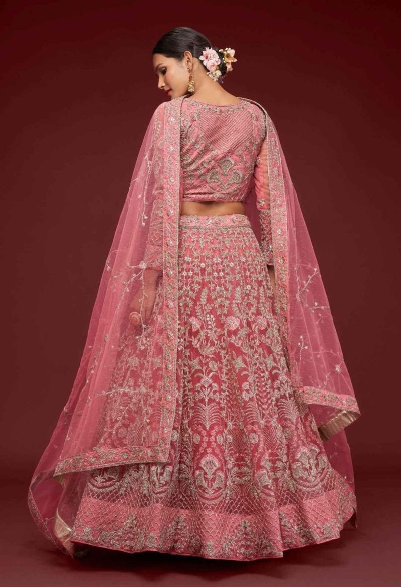 Dusty pink lehenga with all-over zari embroidery and sheer net dupatta drape