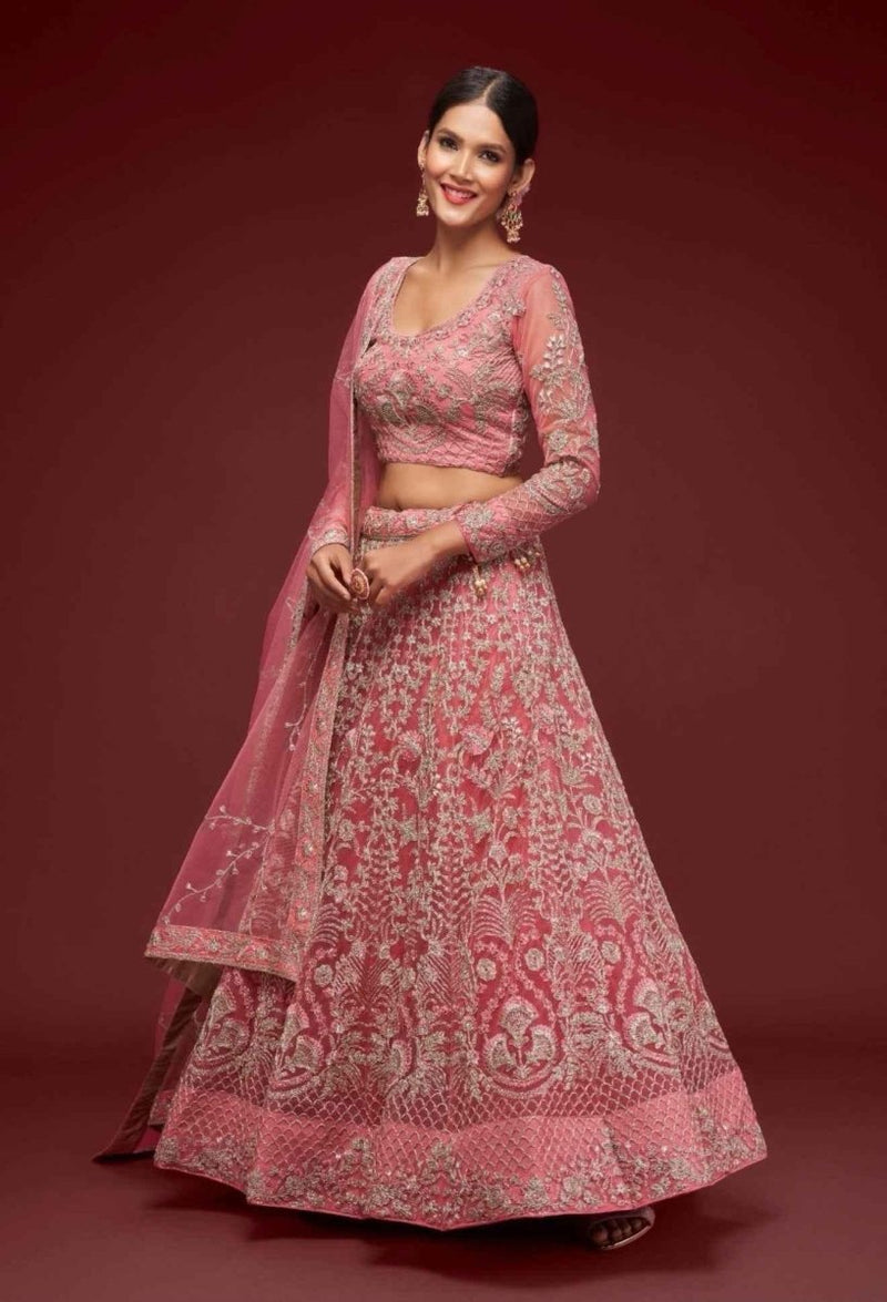 Dusty pink net lehenga with ornate zari embroidery, long sleeves and matching dupatta
